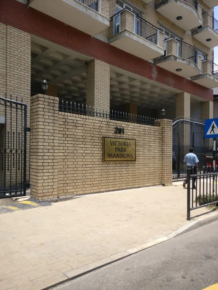 Brick entrance and boundary wall of a multi-storey building
